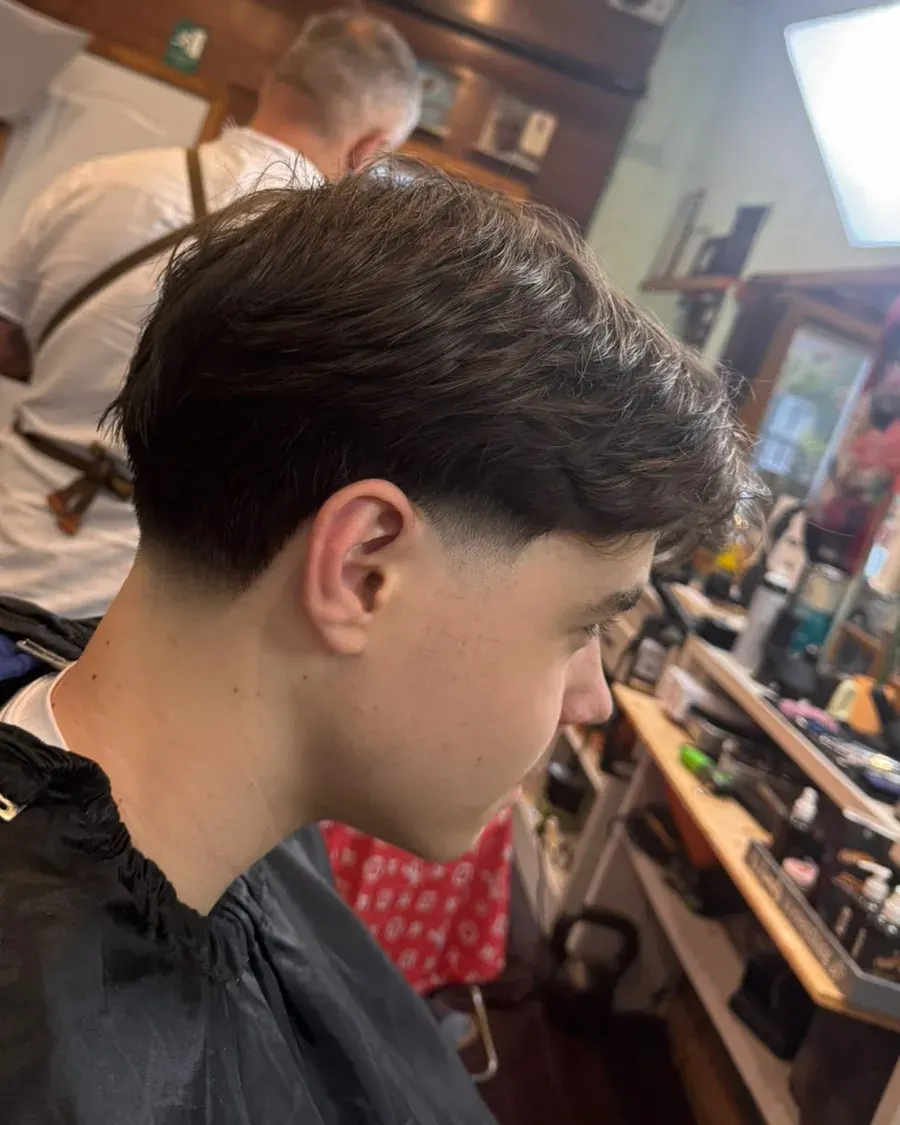 Layered taper, natural weight — a cut finished at Amit Blends.
