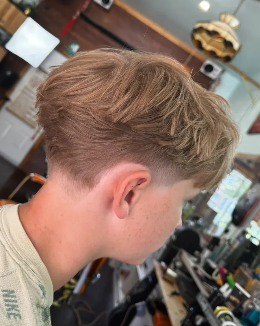 Textured crop, soft taper — a cut finished at Amit Blends.